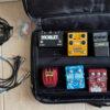 multiple guitar effects pedals with pedal board