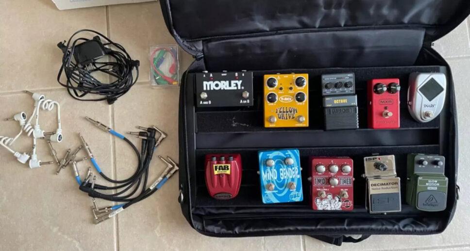 multiple guitar effects pedals with pedal board