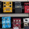 multiple guitar effects pedals with pedal board