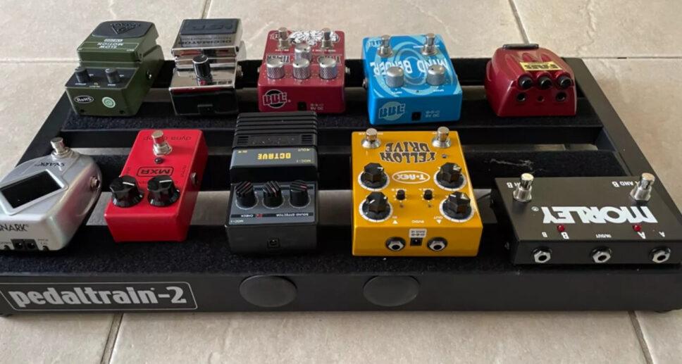 multiple guitar effects pedals with pedal board