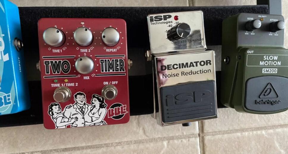 multiple guitar effects pedals with pedal board
