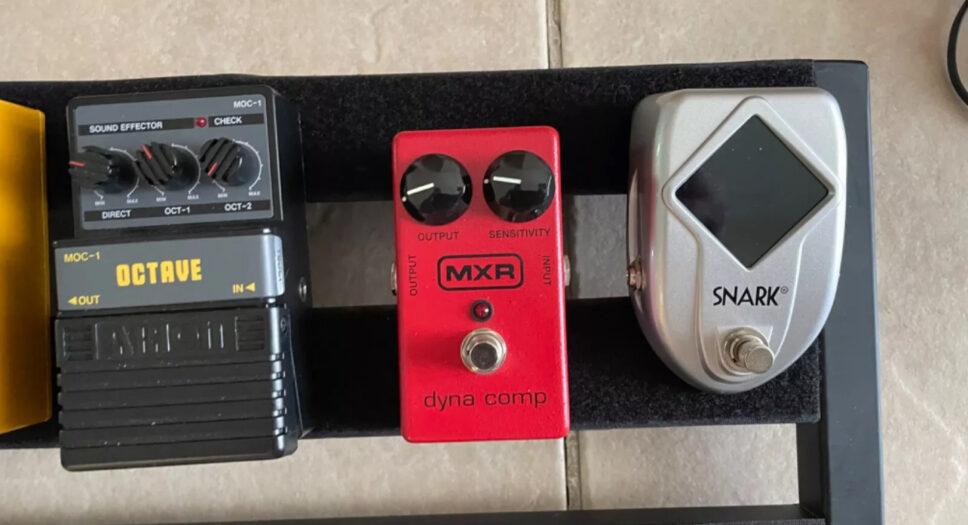 multiple guitar effects pedals with pedal board
